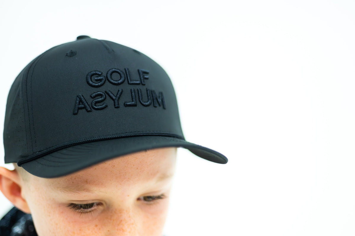 Junior in a black Off Script cap, close up