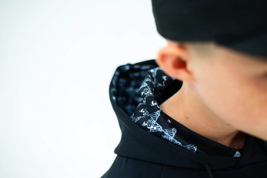 Patterned lining inside the black hoodie's hood
