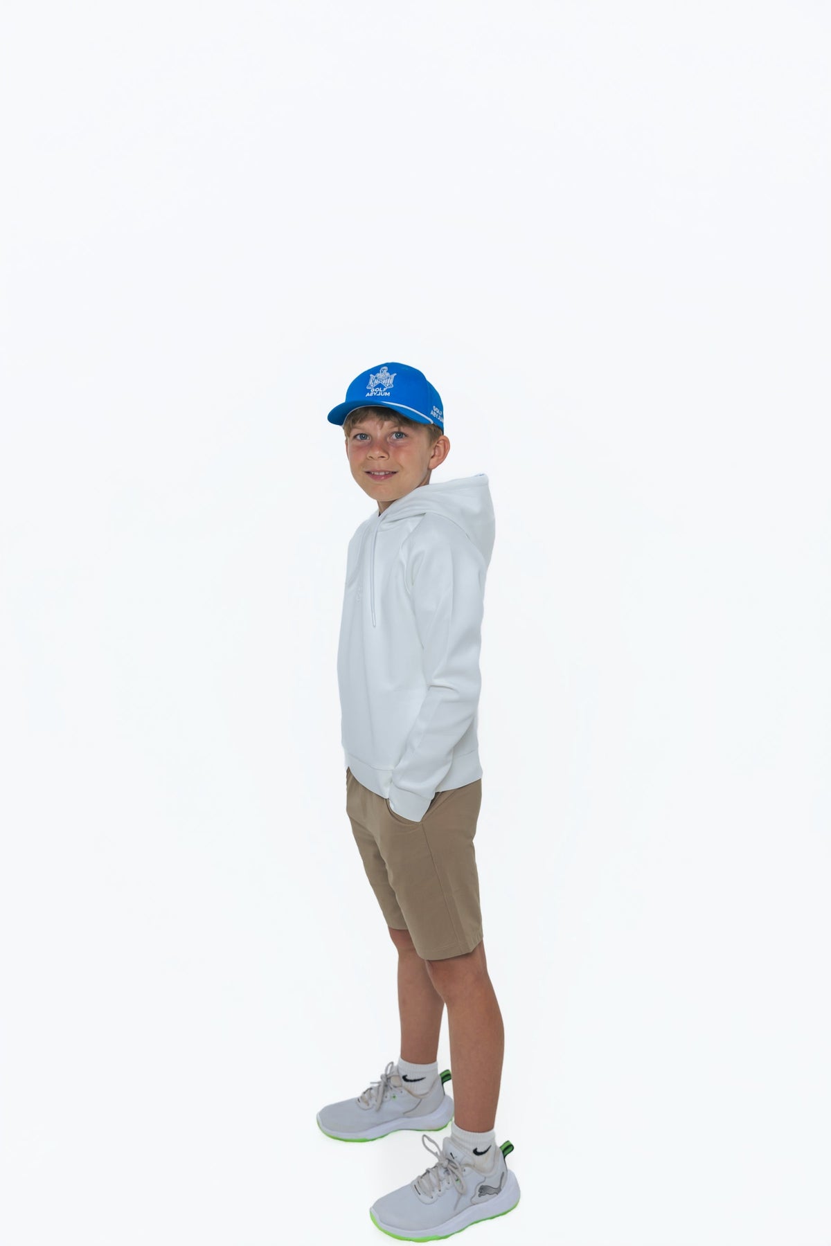 Junior golfer in Golf Asylum shorts