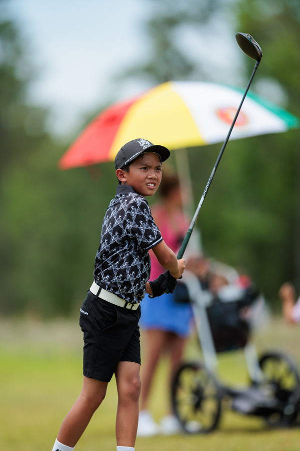 Junior golfer with his driver at the Golf Asylum Invitational